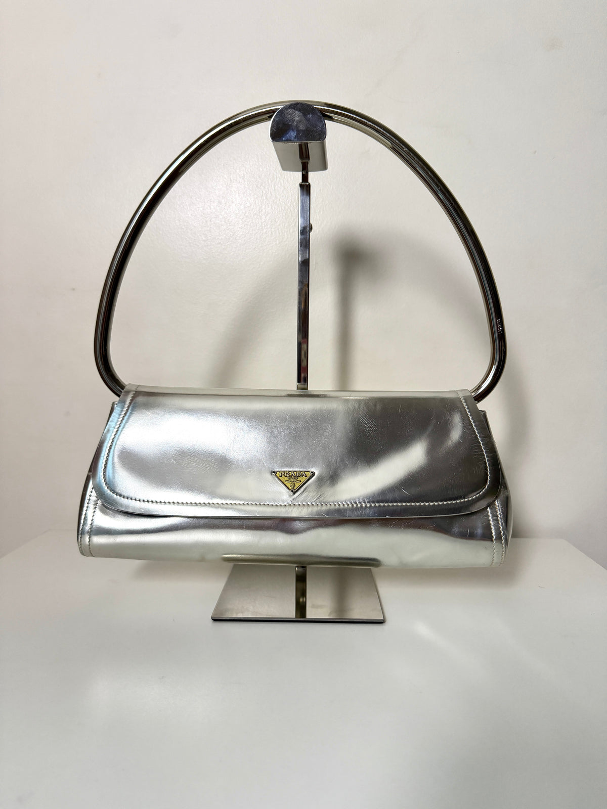 AVAILABLE | Prada Metallic Silver Swing 2003
