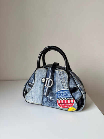 AVAILABLE | Christian Dior Distressed Denim Speedway Saddle Bowler Bag