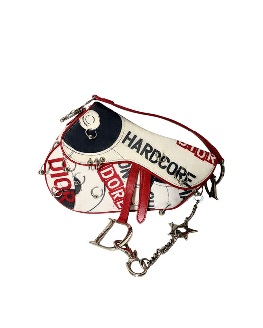AVAILABLE | Christian Dior Hardcore Canvas Pierced Saddle Bag