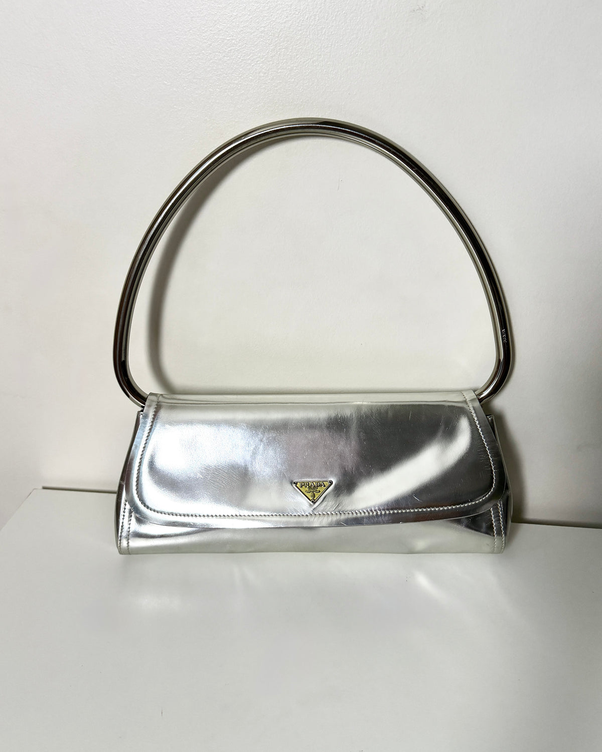 AVAILABLE | Prada Metallic Silver Swing 2003