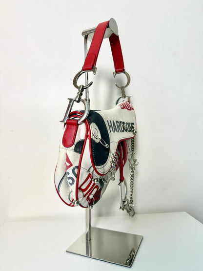 AVAILABLE | Christian Dior Hardcore Canvas Pierced Saddle Bag