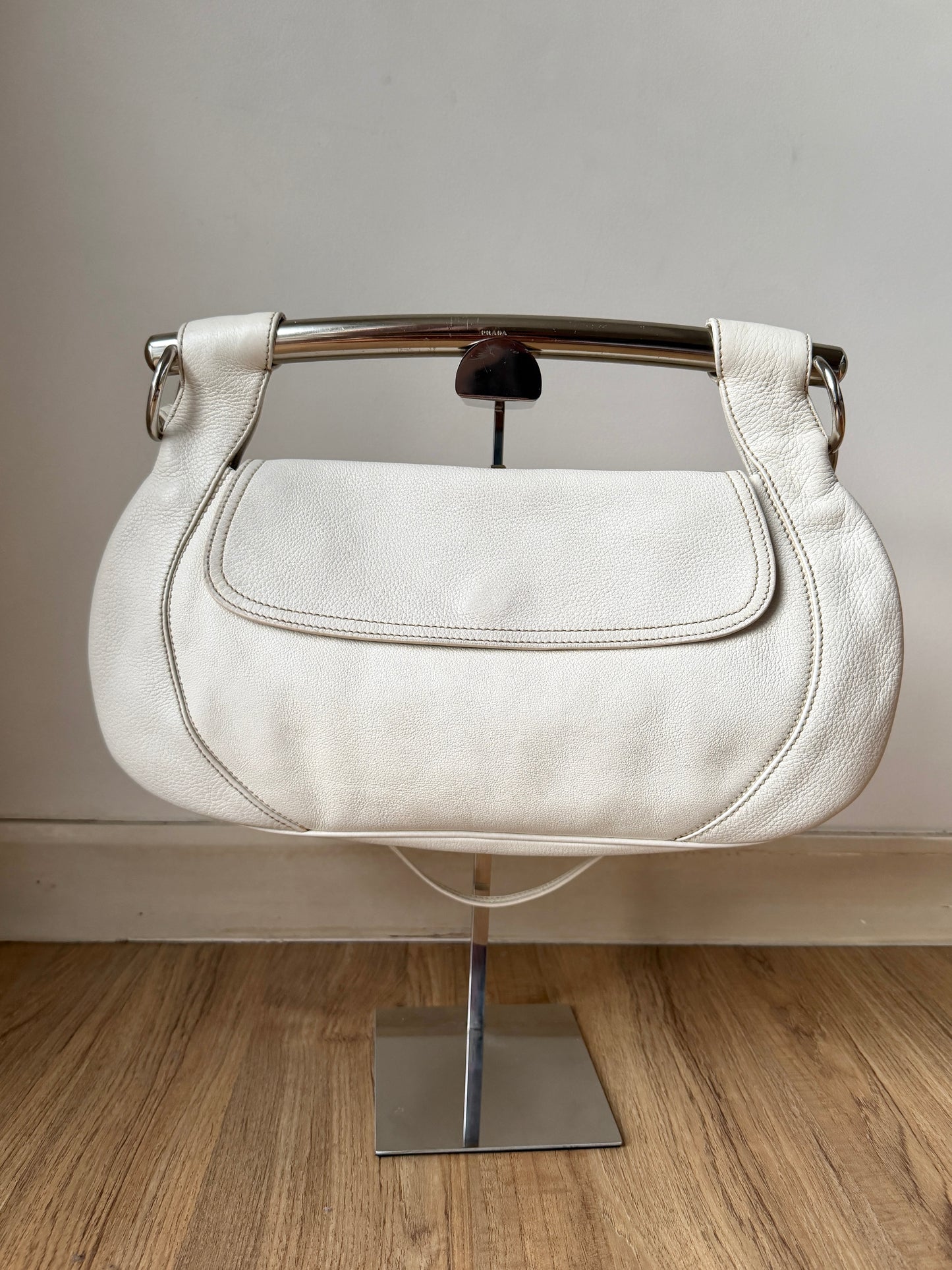 AVAILABLE | Prada Vitello Daino White Pebbled Halfmoon Swing Bag – White